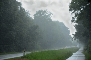 Road with bad visibility due to heavy rain.