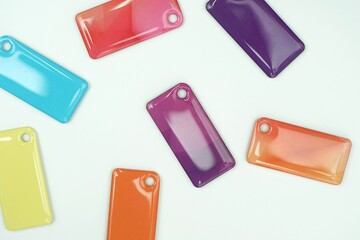 many access cards, key chains, different colors on a white background, individual access cards to the room