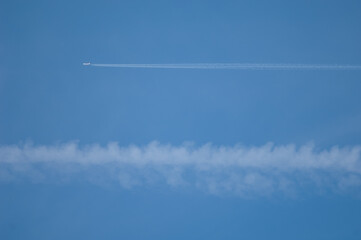 Airplane and contrail of another airplane to the bottom. Huesca. Aragon. Spain.