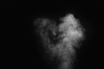 Curly smoke, steam, isolated on a black background. The smoke looks like a ghost. Can be used as abstract background