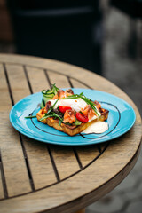 Waffle toast with poached egg and salmon