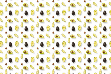 Avocado. Background made from isolated Avocado pieces on white background. Flat lay of fresh ripe avocados and avacado pieces.
