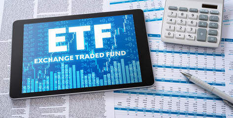 A tablet with financial documents - ETF