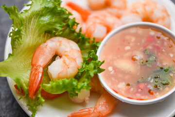 Shrimp delicious seasoning spices on white plate - appetizing cooked boiled shrimps prawns , salad shelfish seafood sauce