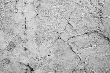 Texture of a concrete wall with cracks and scratches
