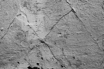 Texture of a concrete wall with cracks and scratches