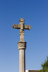 Stone cross at the entrance of a village