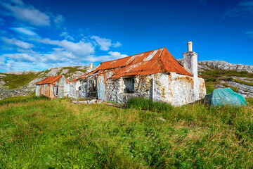 An old ruined croft with a rusty red tin roof at Quidnish © Helen Hotson
