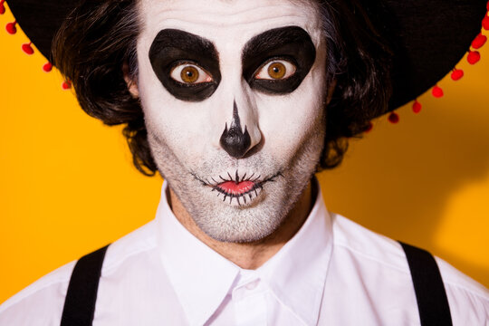 Closeup headshot photo of frightening creepy mime bristle guy funny scary expression crazy look eyes wear white shirt death costume sugar skull suspenders isolated yellow color background