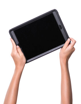 two child's hands holding a tablet