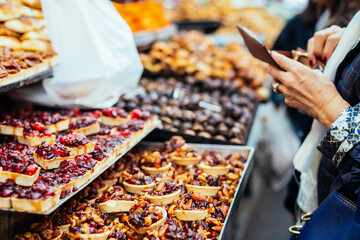 Women buing sweets in the Jerusalem market, Israel.