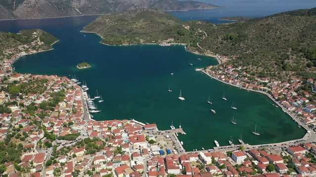 Aerial drone video of picturesque village capital and port of Ithaki or Ithaca island called Vathi a safe anchoring for sailboats, Ionian, Greece