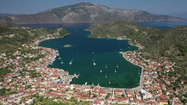Aerial drone video of picturesque village capital and port of Ithaki or Ithaca island called Vathi a safe anchoring for sailboats, Ionian, Greece