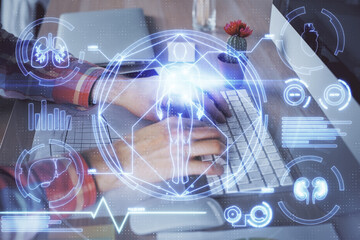 Science hologram with man working on computer on background. Concept of study. Double exposure.