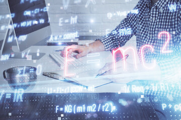 Science formula hologram with man working on computer on background. Education concept. Double exposure.