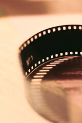 Negative of a film camera  with wooden background / Macro photography