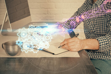 Businessman working on DeskTop with technology theme drawing. Concept of big data. Double exposure.