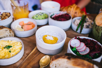 Various tasty dishes on wooden table