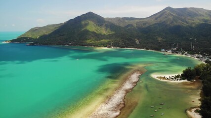Fototapeta premium Aerial drone view island Koh Phangan Thailand. Exotic coast panoramic landscape, Chaloklum Malibu fisherman beach, summer day. Sandy path, corals. Vivid seascape, mountain coconut palms from above.