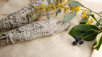 Fototapeta premium Dried white sage smudge stick, relaxation and aromatherapy. Smudging during psychic occult ceremony, herbal healing, yoga or aura cleaning. Essential incense for esoteric rituals and fortune telling