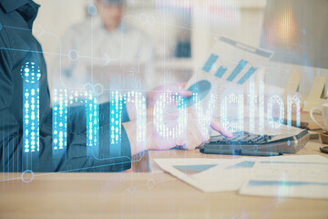 Multi exposure of tech drawings with man working on computer background. Concept of innovation.