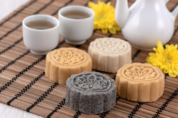 Colorful beautiful moon cake, mung bean cake, Champion Scholar Pastry cake for Mid-Autumn festival traditional gourmet dessert snack, close up.