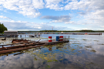 wood, the old pier with the barrels to fuel the engines of boats on the reservoir