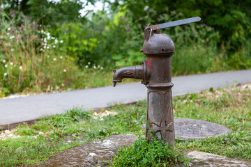 Old metal water pump for water intake
