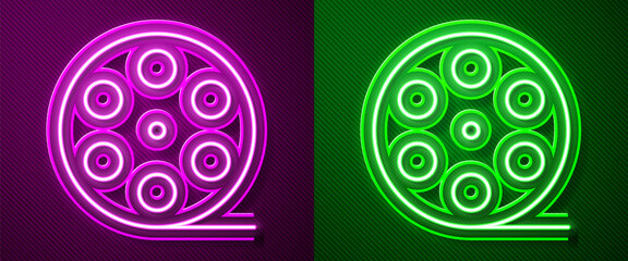 Glowing neon line Film reel icon isolated on purple and green background. Vector Illustration.