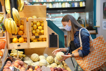 Woman at fresh food market wearing face mask