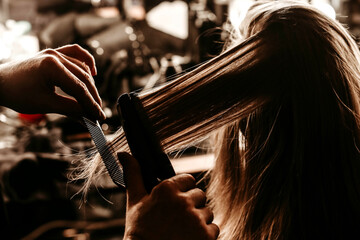 Brushing hair of a model at the fashion week backstage.