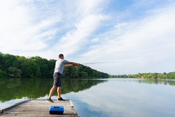 Young man fishing in the river