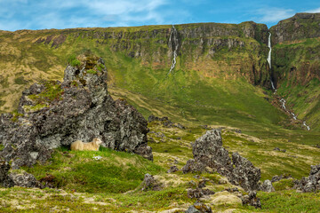 Fototapeta na wymiar Iceland landscape with sheep, mountains and waterfalls