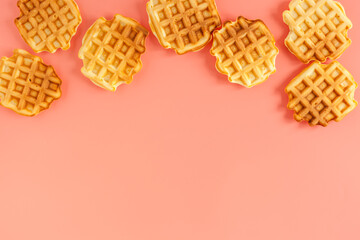 Traditional belgian waffles on pink background top view mockup