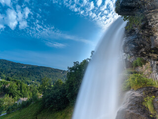 Steinsdalsfossen (also called ovsthusfossen or ofsthusfossen) waterfall in the village of Steine,...