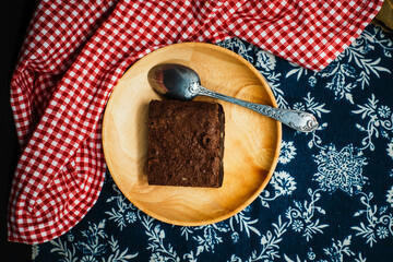 Chocolate Brownie cake on a dark plate