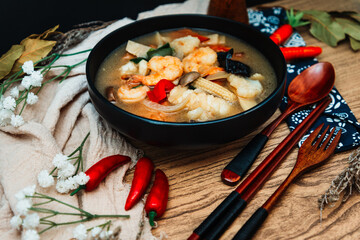 Bowls of Asian soup noodles and vegetables with Chopstick