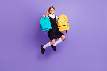 Fototapeta na wymiar Full length body size view of her she nice attractive cheerful small little girl jumping carrying bags autumn season isolated bright vivid shine vibrant lilac violet purple color background