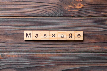 massage word written on wood block. massage text on cement table for your desing, concept