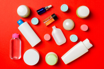 Group of plastic bodycare bottle Flat lay composition with cosmetic products on colored background empty space for you design. Set of White Cosmetic containers, top view with copy space