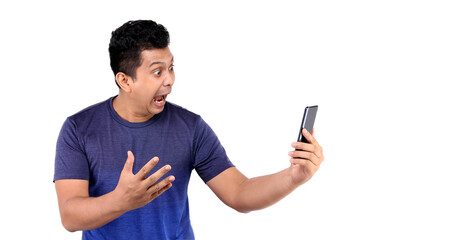 Shock and surprise face of Asian man presenting smart phone on white background in studio With copy space