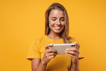 Positive young woman playing games