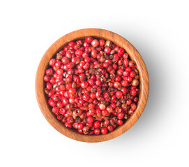 Dried pink peppers in bowl top view on white background
