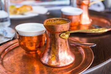 Serving Bosnian coffee in a copper cezve in Sarajevo. Bosnia and Herzegovina