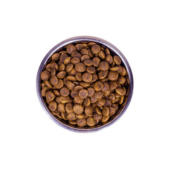 Top view of brown biscuit bones and crunchy organic kibble pieces for dog feed in a metal bowl isolated on white background. Healthy dry pet food concept.
