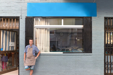 Qualified workman upholstering furniture in repair furniture