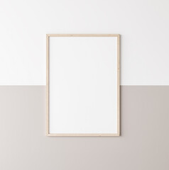 Mockup poster frame, vertical wooden frame on beige and white wall, 3d render