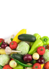 Ripe fresh vegetables in a large assortment on a white background, vertical panorama. Food background. The view from the top. The concept of natural products, proper nutrition.