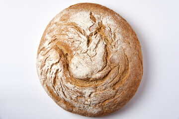 loaf of bread on top on a white background