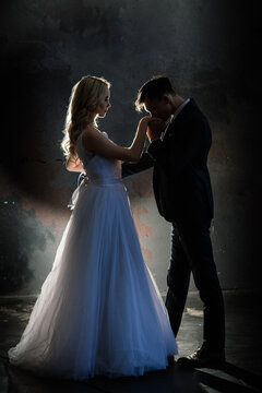 Art fashion studio photo of wedding couple silhouette groom and bride.